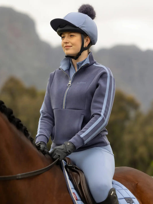 LeMieux Connie half zip sweater featuring bra ded quarter zip and athletic arm stripes