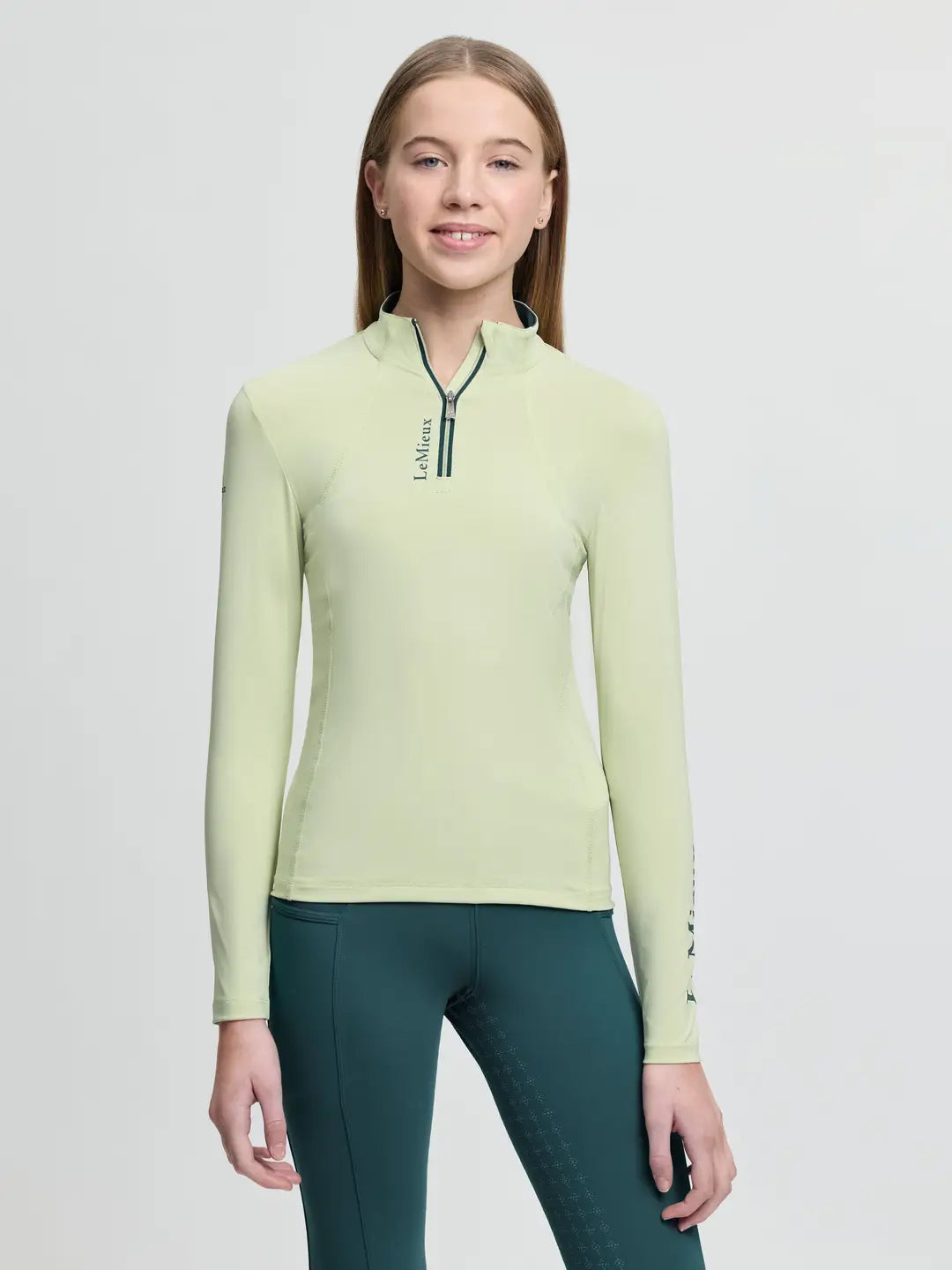 LeMieux Young Rider Base Layer in Macaron featuring a quarter-zip neck and moisture-wicking thermal fabric