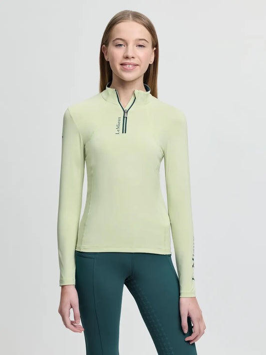 LeMieux Young Rider Base Layer in Macaron featuring a quarter-zip neck and moisture-wicking thermal fabric